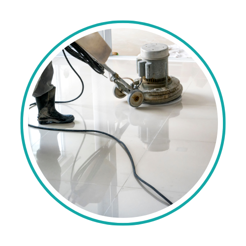 ServiceMaster technician cleaning vinyl flooring in a commercial building