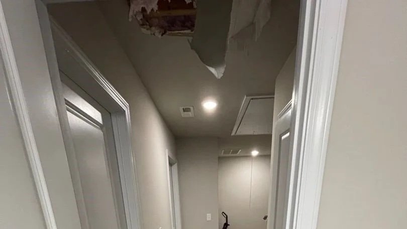 Hallway ceiling damage after HVAC unit leaked