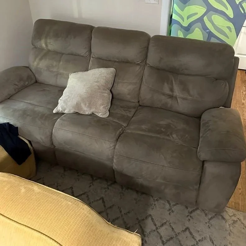 Recliner sofa before ServiceMaster upholstery deep cleaning