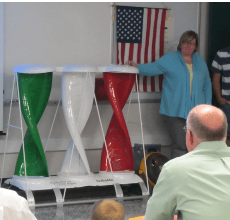 TurboMill community partner helping students present the TurboMill to the school board.