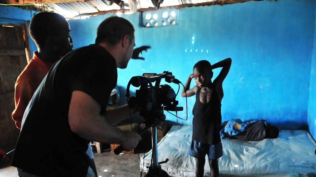 Banker White with WeOwnTV at work in Sierra Leone