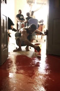 Alluspa King paints the floors of the Media Center.