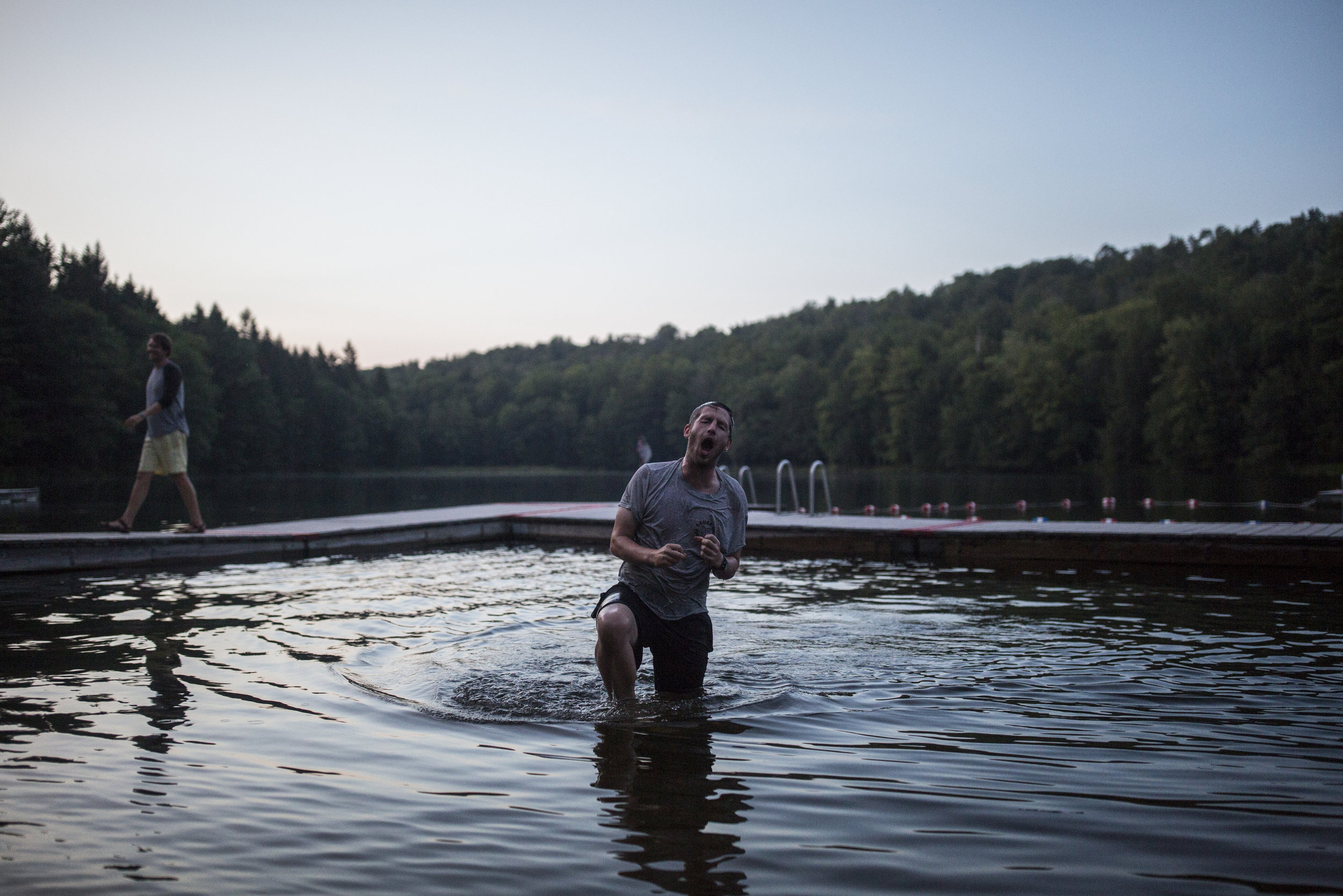  Jack Schott, one of the founders and directors of stomping ground, reacts to being thrown in the lake at the end of an all-camp game. 