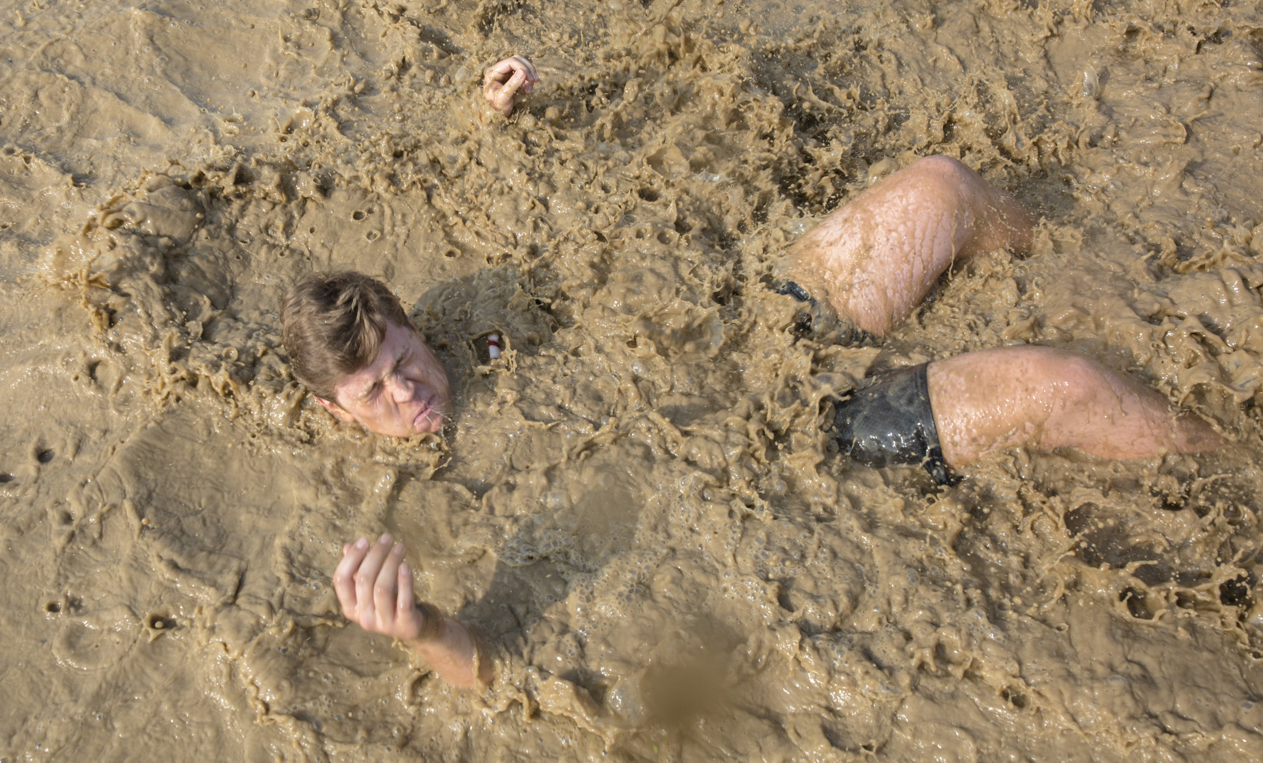  Marcus Risch falls into a mud pit before the 22nd Annual Mud Tug at RIT on September 16, 2017. Mud Tug is an annual Tug of War competition put on by RIT's Phi Kappa Psi fraternity and Zeta Tau Alpha sorority to benefit the Hillside Family of Agencie