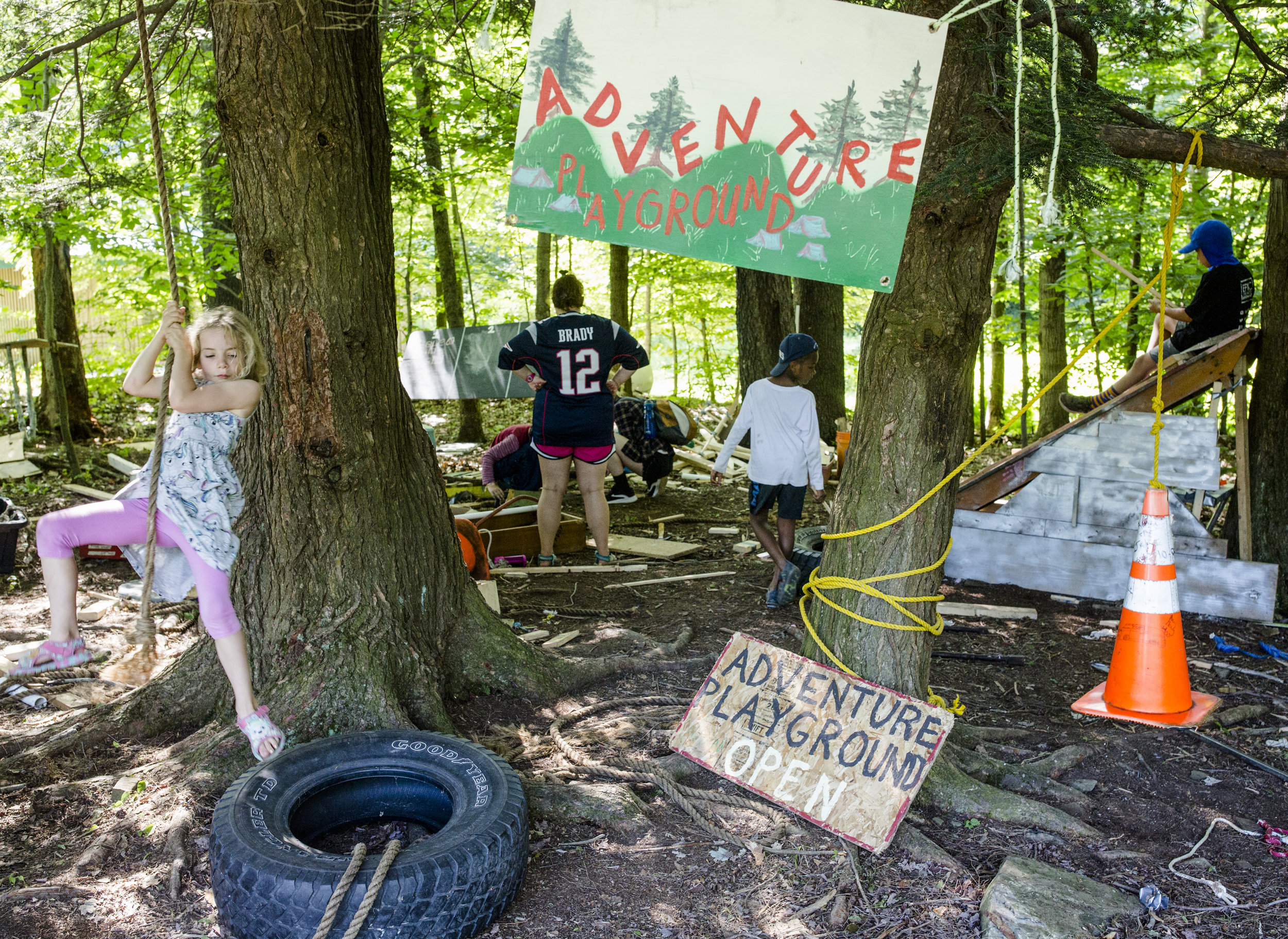  Campers play in the adventure playground during an activity period. The adventure playground is an area where campers can use real tools and materials to build.  