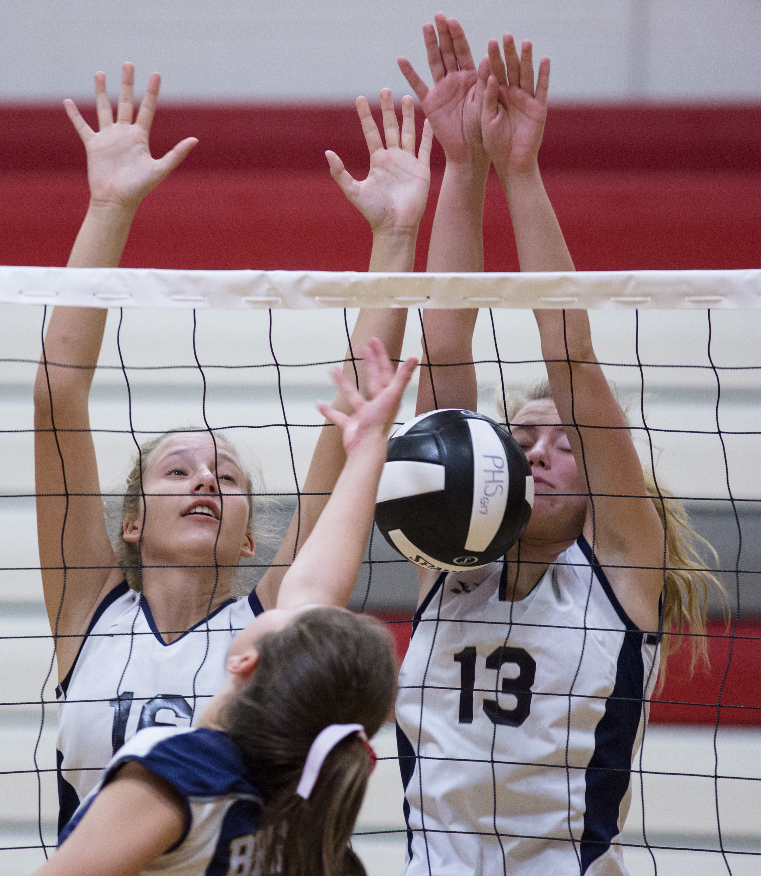 A Brighton volleyball player hits a ball into the net during a game against the Bayport-Blue Point Phantoms at the Penfield Varsity Volleyball Tournament on September 2, 2017 in Penfield, N.Y. 