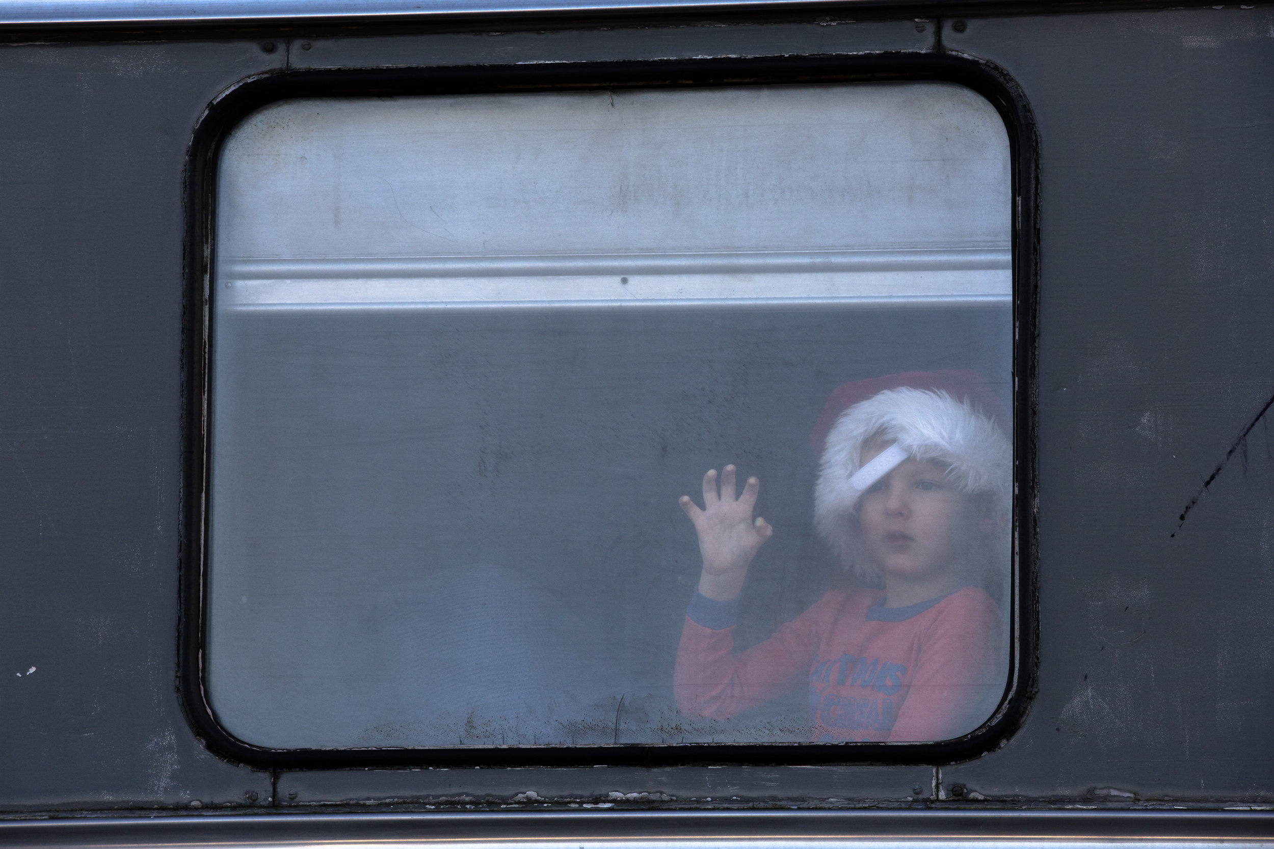  A child looks out the window of a train at the Medina Railroad Museum during the Polar Express Event on Dec. 2, 2018 in Medina, N.Y. 