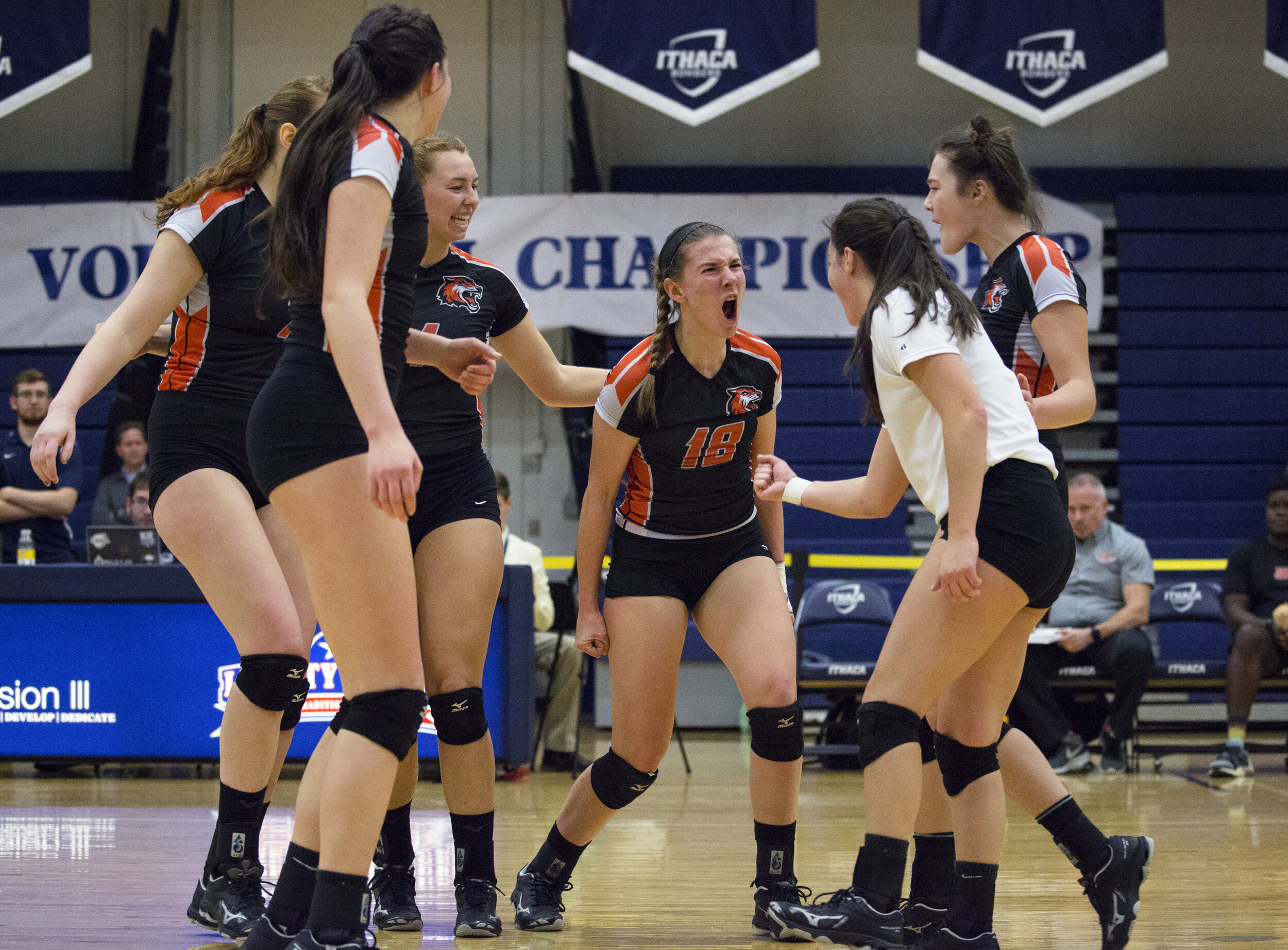  Erin Parkinson (18, center) cheers after winning a point during the Liberty League Finals against Clarkson University on Nov. 3, 2018 at Ben Light Gymnasium in Ithaca, N.Y. RIT defeated Clarkson in the fourth set to win their first championship in L