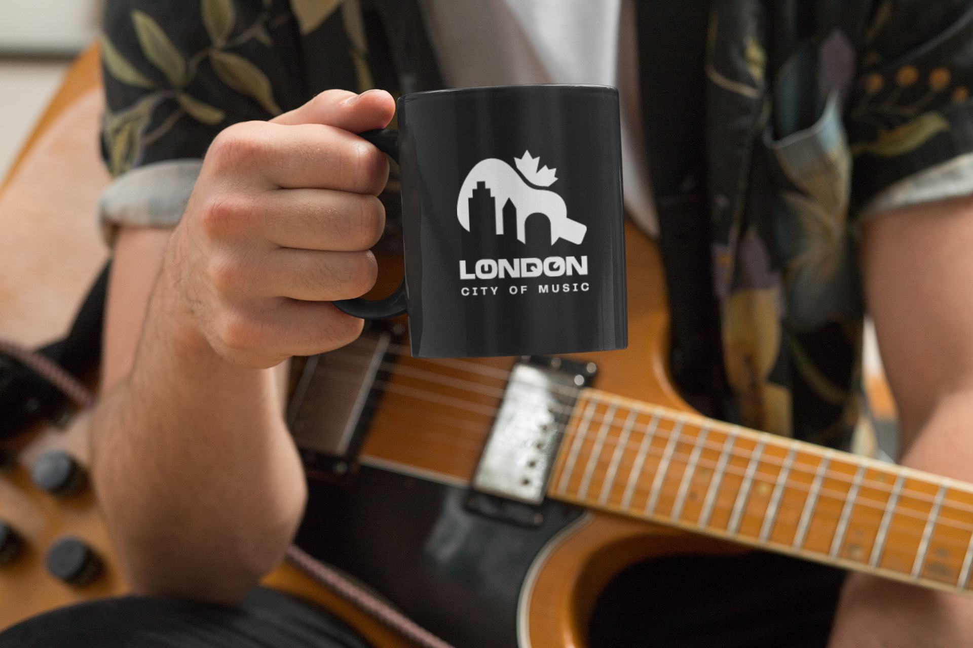 mockup-of-a-musician-holding-an-11-oz-coffee-mug-33324.png