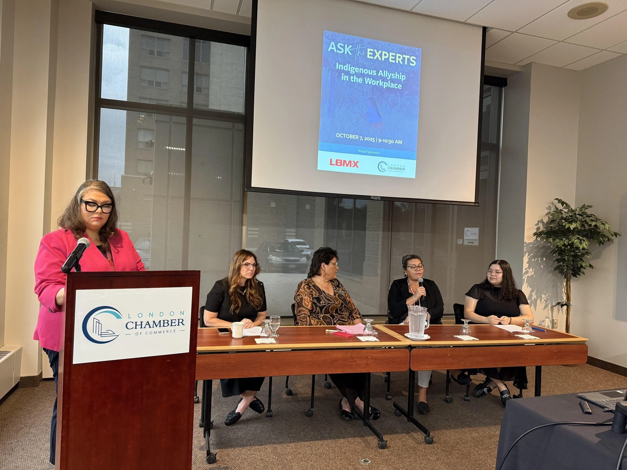Katie Wilhelm leading a panel discussion