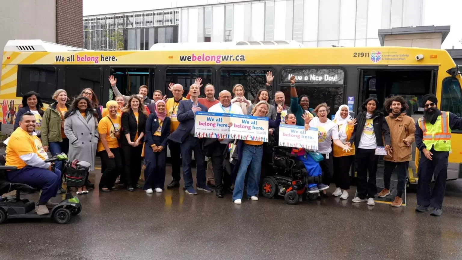 Waterloo leaders pose in front of the bus design