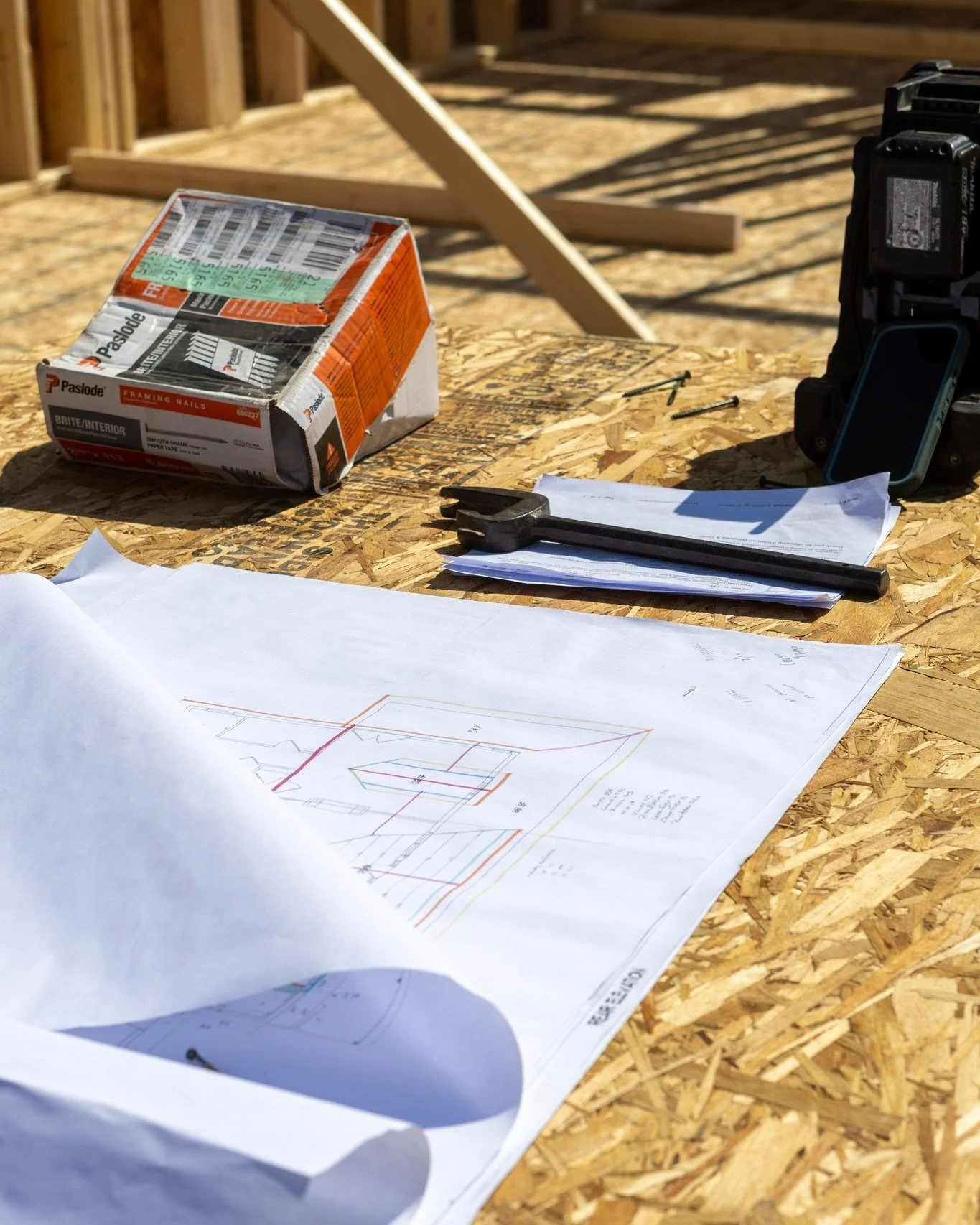A man writing down project details in order to provide an estimate.