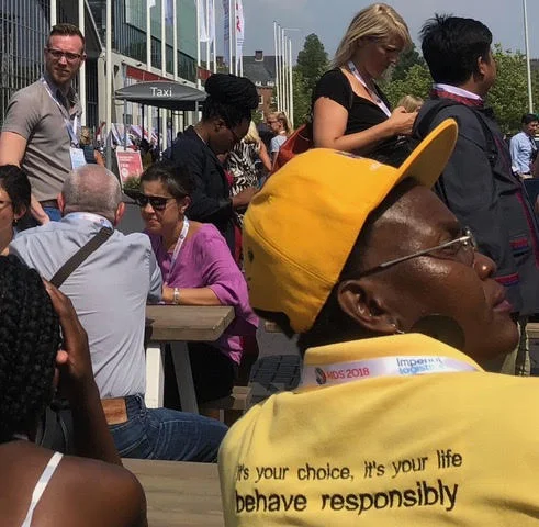 Message on yellow shirt. Michael Lecker surveys the crowd far left.