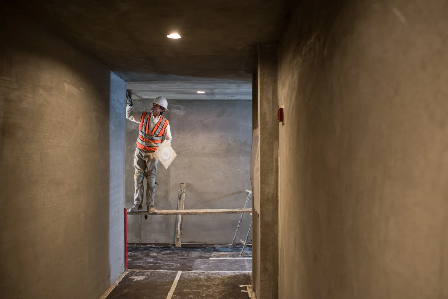 Nautilus General Contractor working on building interior, builder, construction photographer, contractor photography, lifestyle photography, lifestyle of architecture