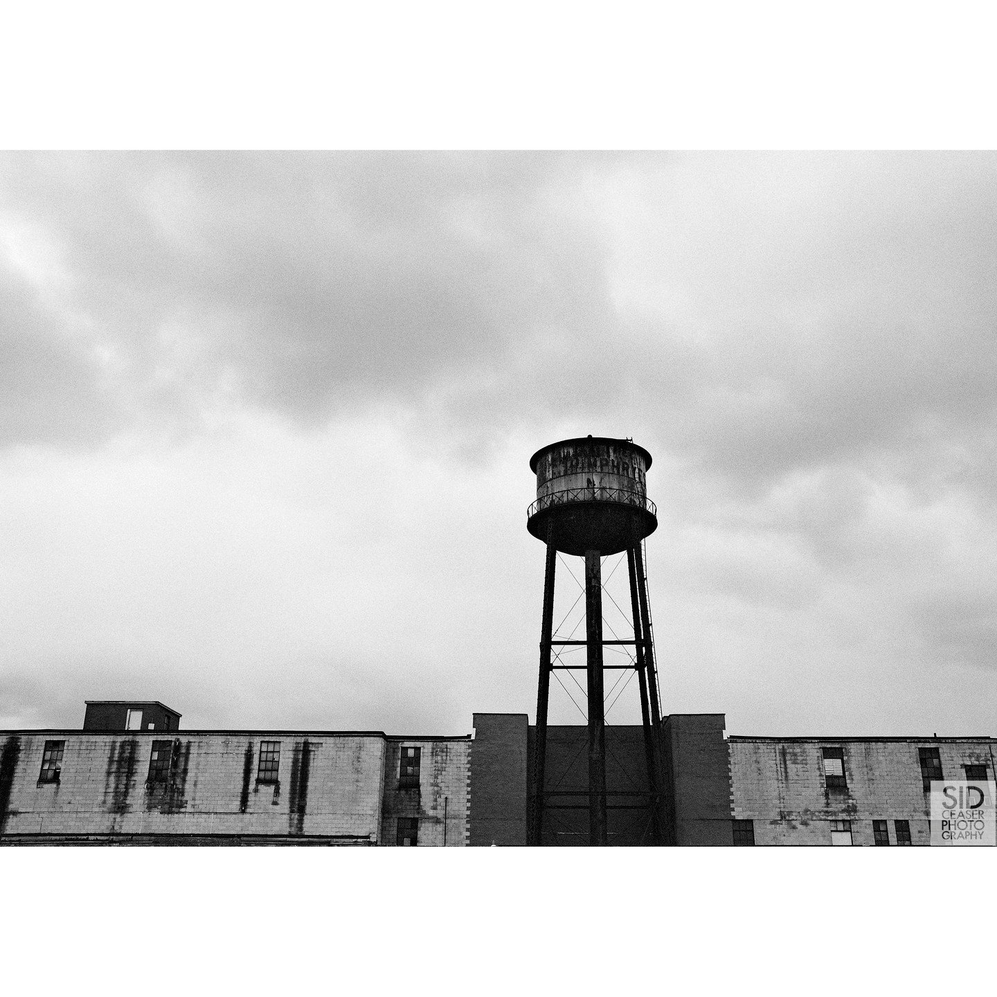 Near the Brost Foundry tower in Mansfield, OH. We took a random road and this semi-abandoned building was sitting there with this excellently rusted tower on top.

I was practically running towards this building when I got out of the car. There were 