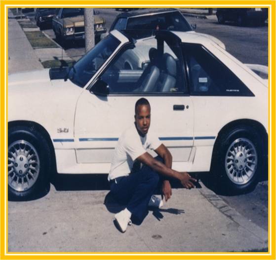 Pierre Romain in front of the white Mustang