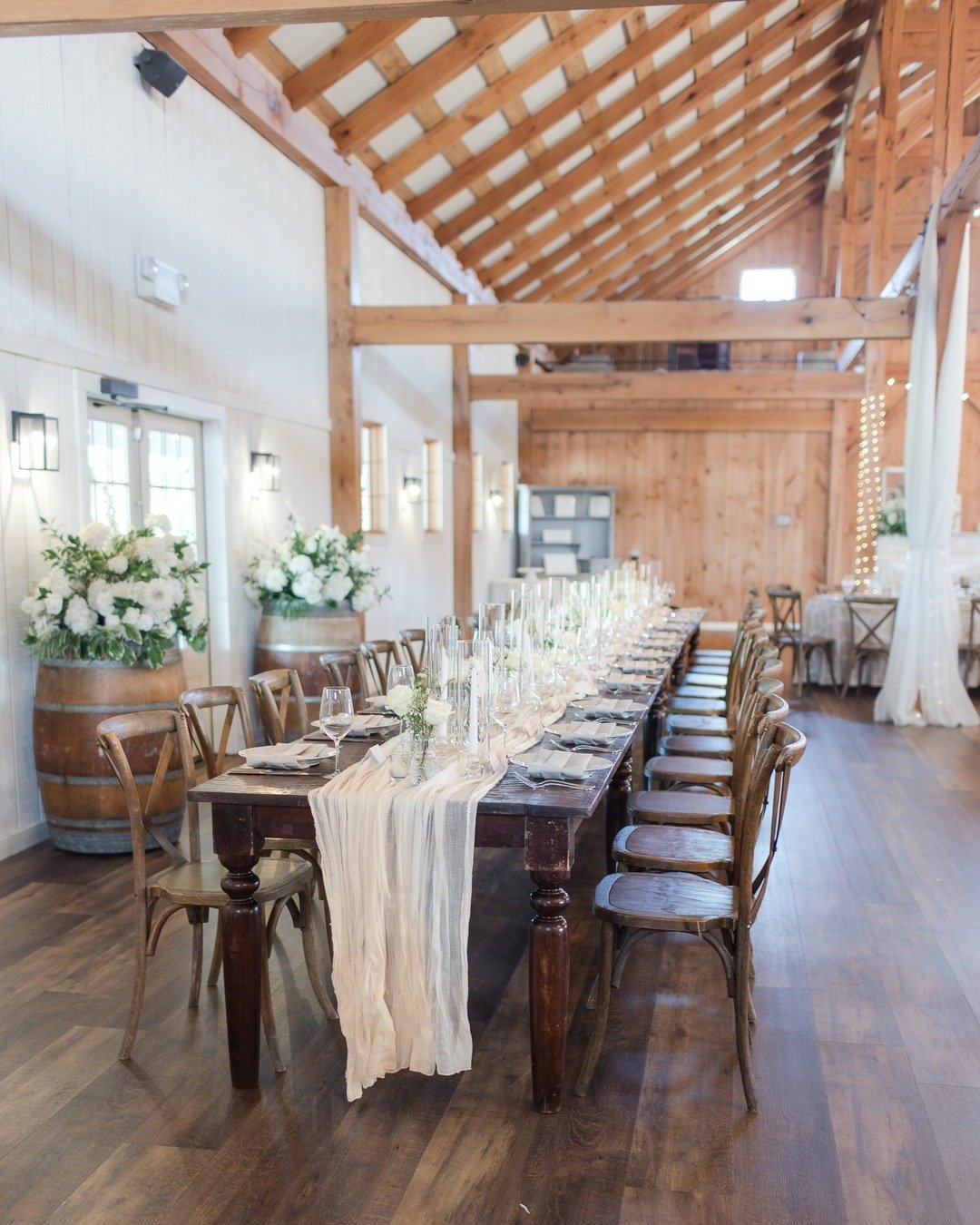 We prefer big lovely florals if you are using wine barrels, and a head table with all your besties!

For 2026 inquiries, visit www.floralsbykimberly.com/inquire

white flowers floral trend | elegant wedding reception | white flowers and greenery flor