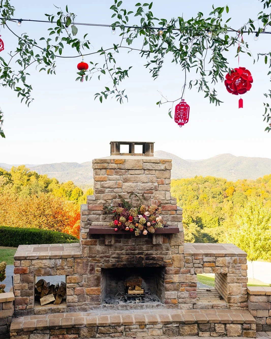 Lucky red lanterns swayed overhead as guests enjoyed this stunning view and fireplace at @housemountaininn.

House Mountain Inn wedding | Virginia wedding florist | Lexington wedding florist | Blue Ridge bride | whimsical wedding flowers | modern wed
