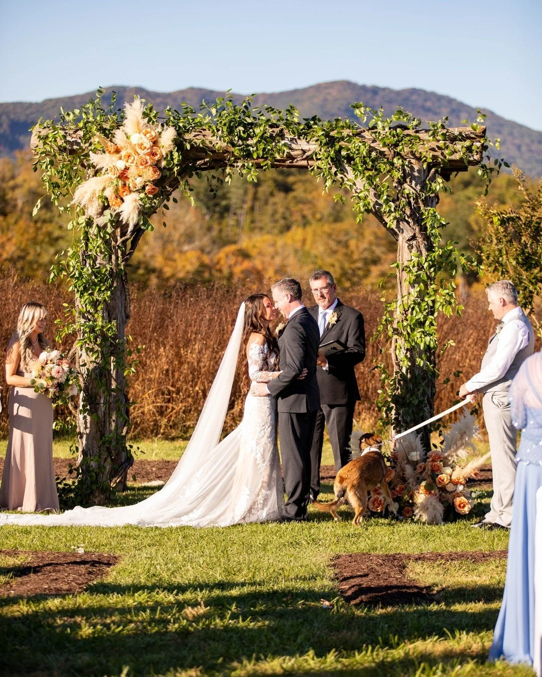 Give us a big arbor and we’ll give you a floral moment to remember! We love creating a stunning focal point for the ceremony.
Happy anniversary to these two lovebirds! Thank you for letting us be a part of your big day!
Floral wedding arbor |