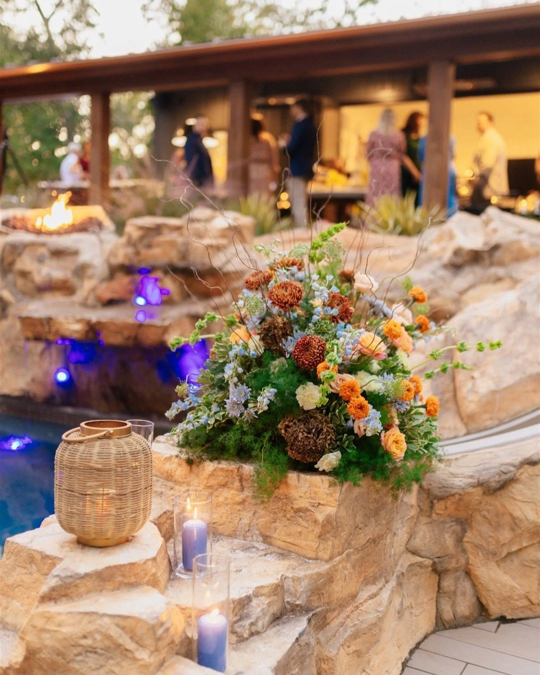 If your venue has a pool, just know we will want to add flowers to it&mdash;floating or otherwise! Adding some rust to the blue/orange/peach palette can lean us towards a lush fall moment. Colored candles and added textures are also a vibe. 

Virgini