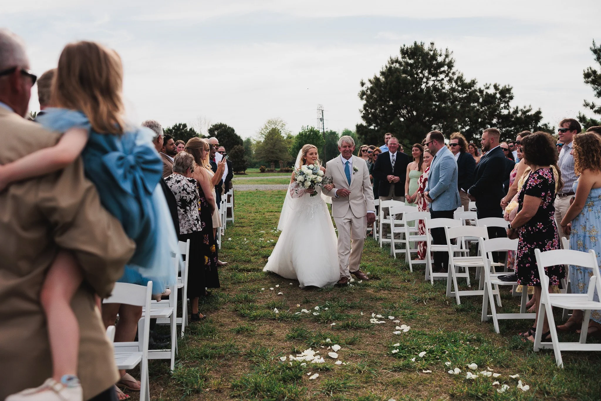 father walking down the isle with daughter