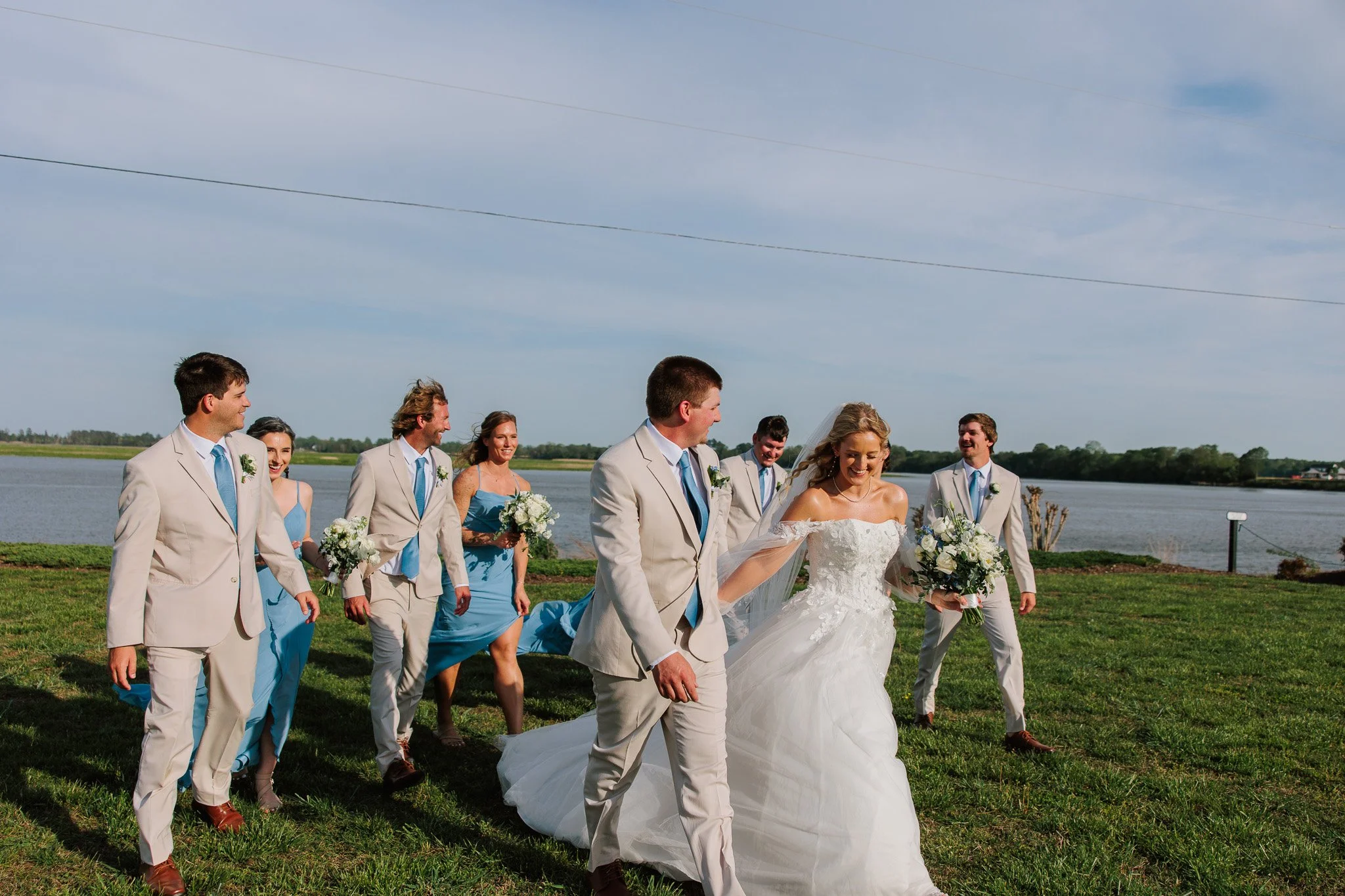 Wedding party photography, bride and groom leading the bridal party