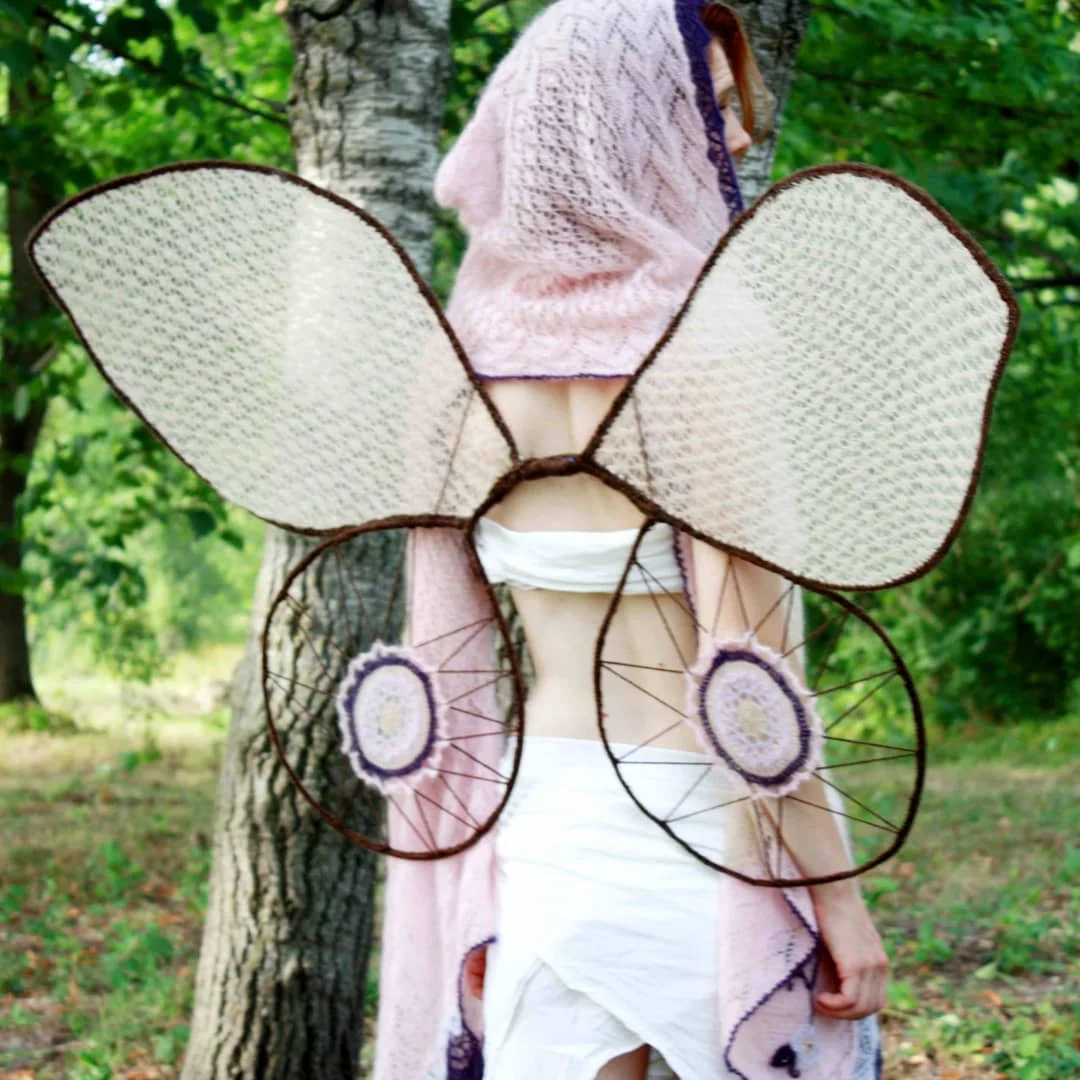 Wing frames are made from fencing wire and electrical tape wrapped in spare yarn.