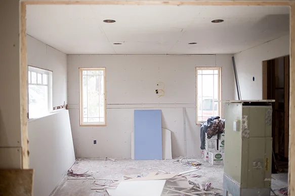 This opening was just the little door pictured below and was a bedroom, but now will be the dining room looking into the living room and we will be adding a Tudor style fireplace between those two windows!