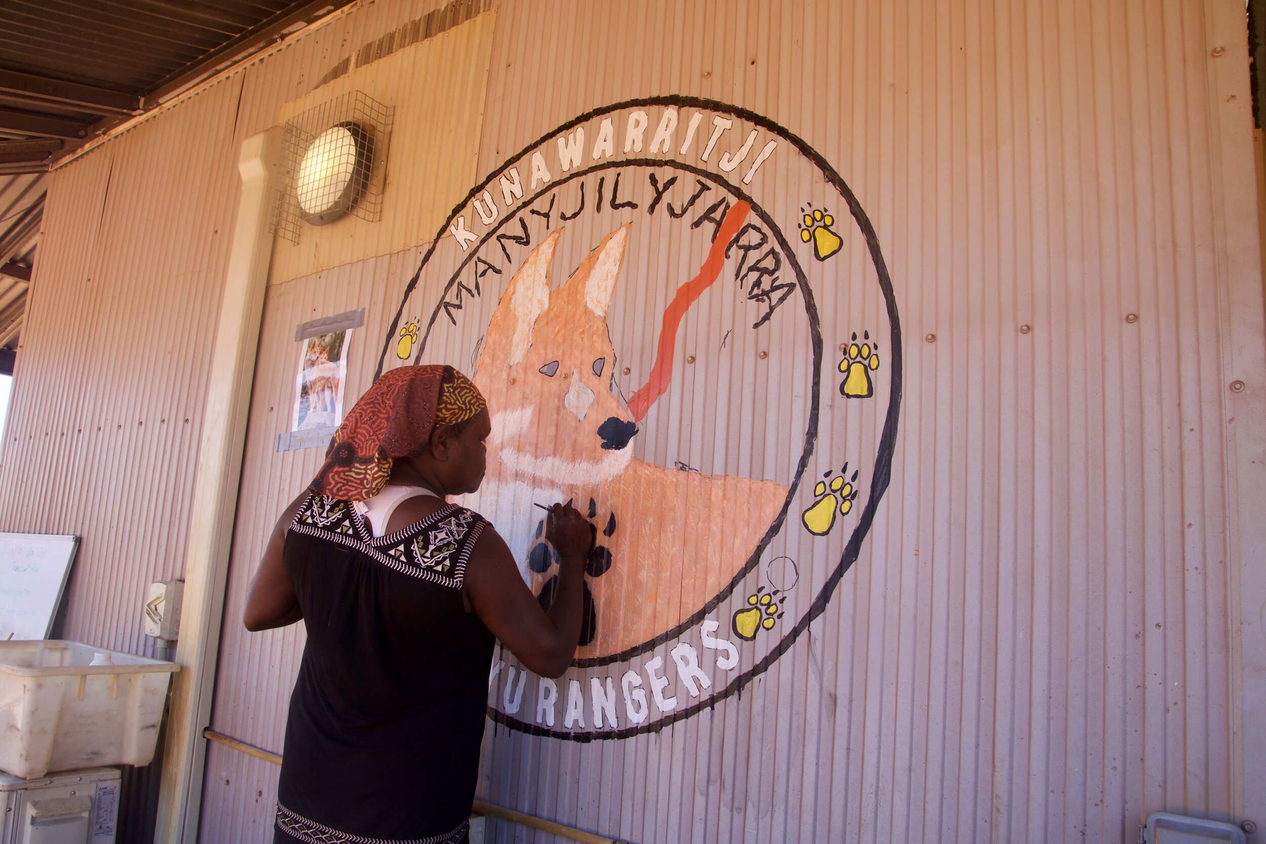 Alana Patch works on mural.jpeg