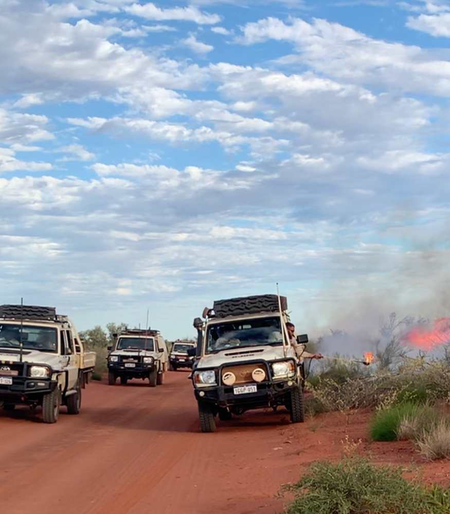 05. Mason using the vehicle-mounted drip torch.png