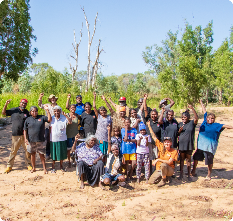 Martu and non-Martu KJ staff working together on Country, reflecting KJ's values of partnership, respect and honesty
