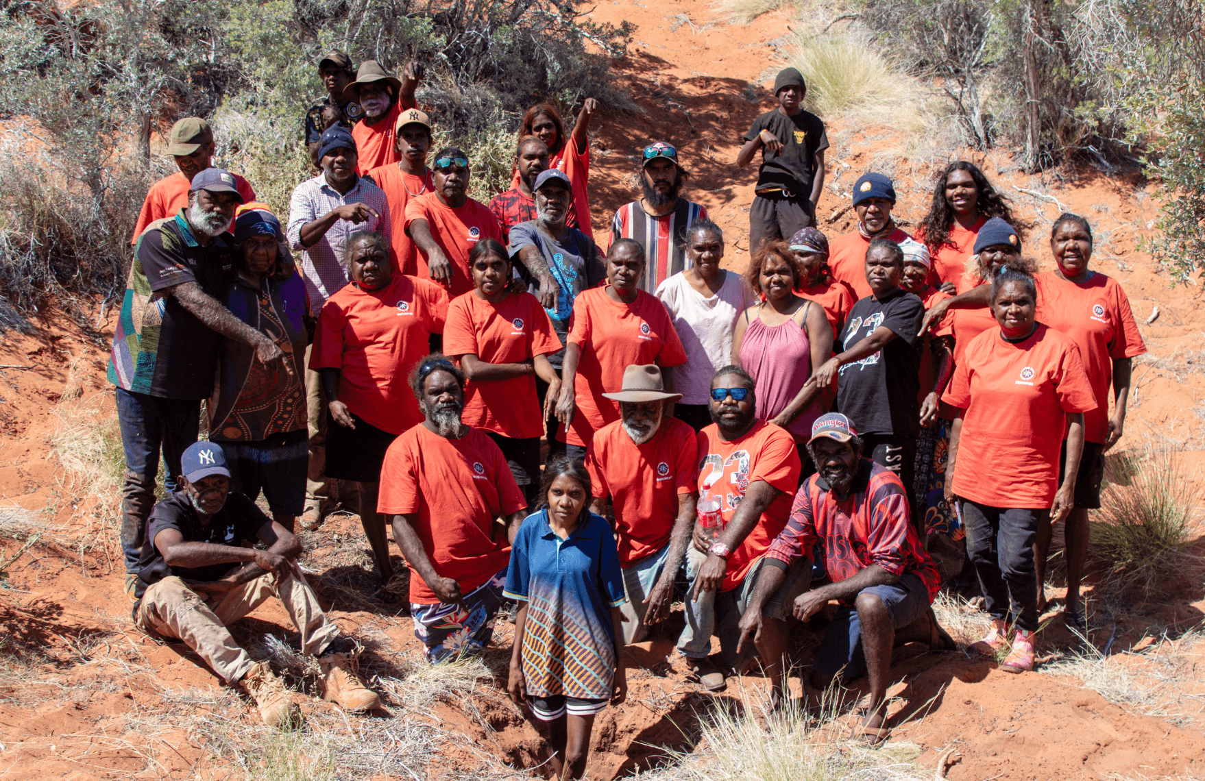 Martu families and KJ staff gathered on Country in Western Australia during a Kanyirninpa Jukurrpa return to country (Kalyuku ninti) trip, taking families back to Country.
