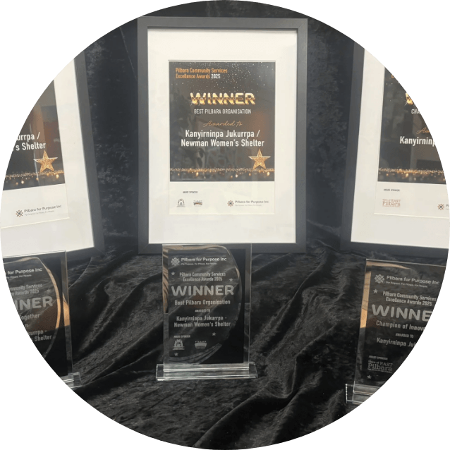 Three Pilbara Community Awards winner trophies recognising KJ as Champions of Change for driving innovation and strengthening Martu futures across the Pilbara