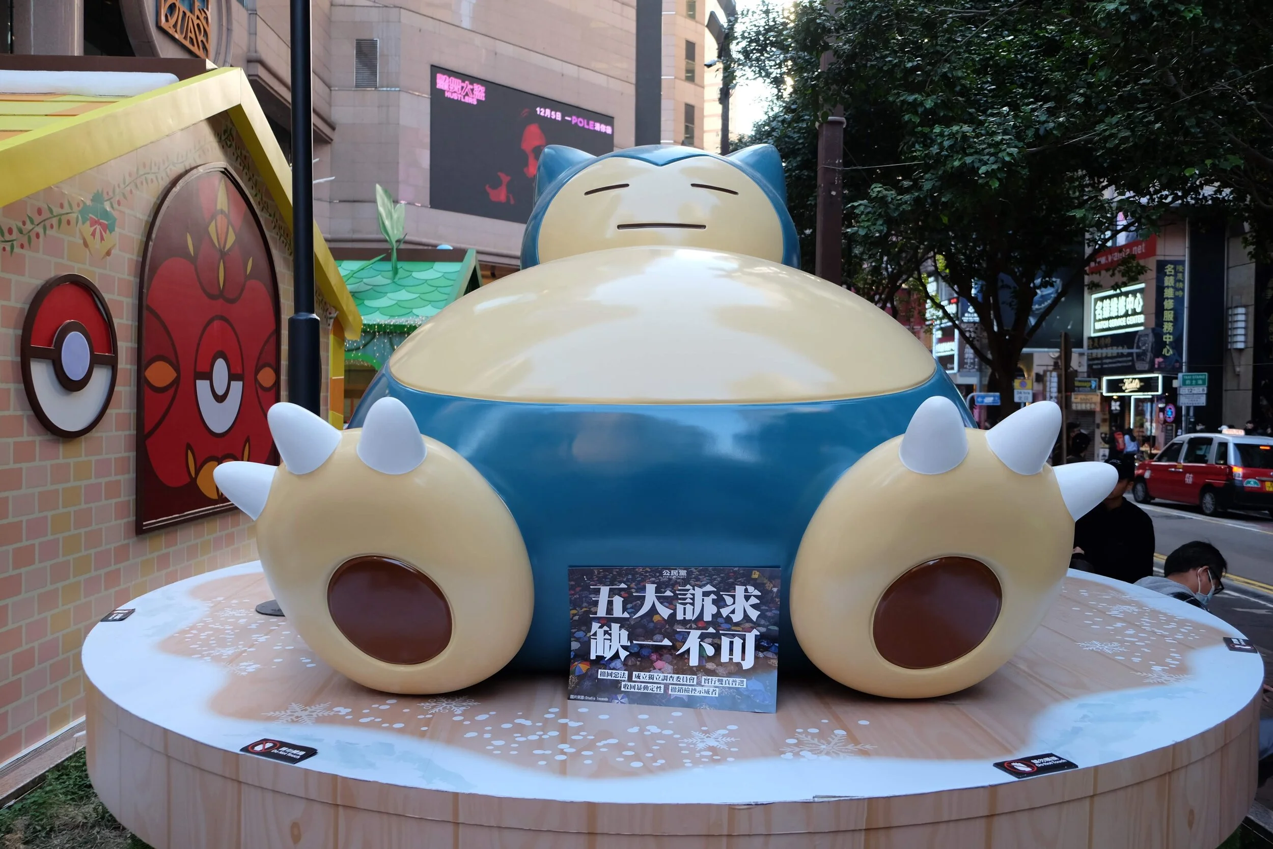 Facial wear, flags and flaming gasoline: Hongkongers march for human rights - six months on