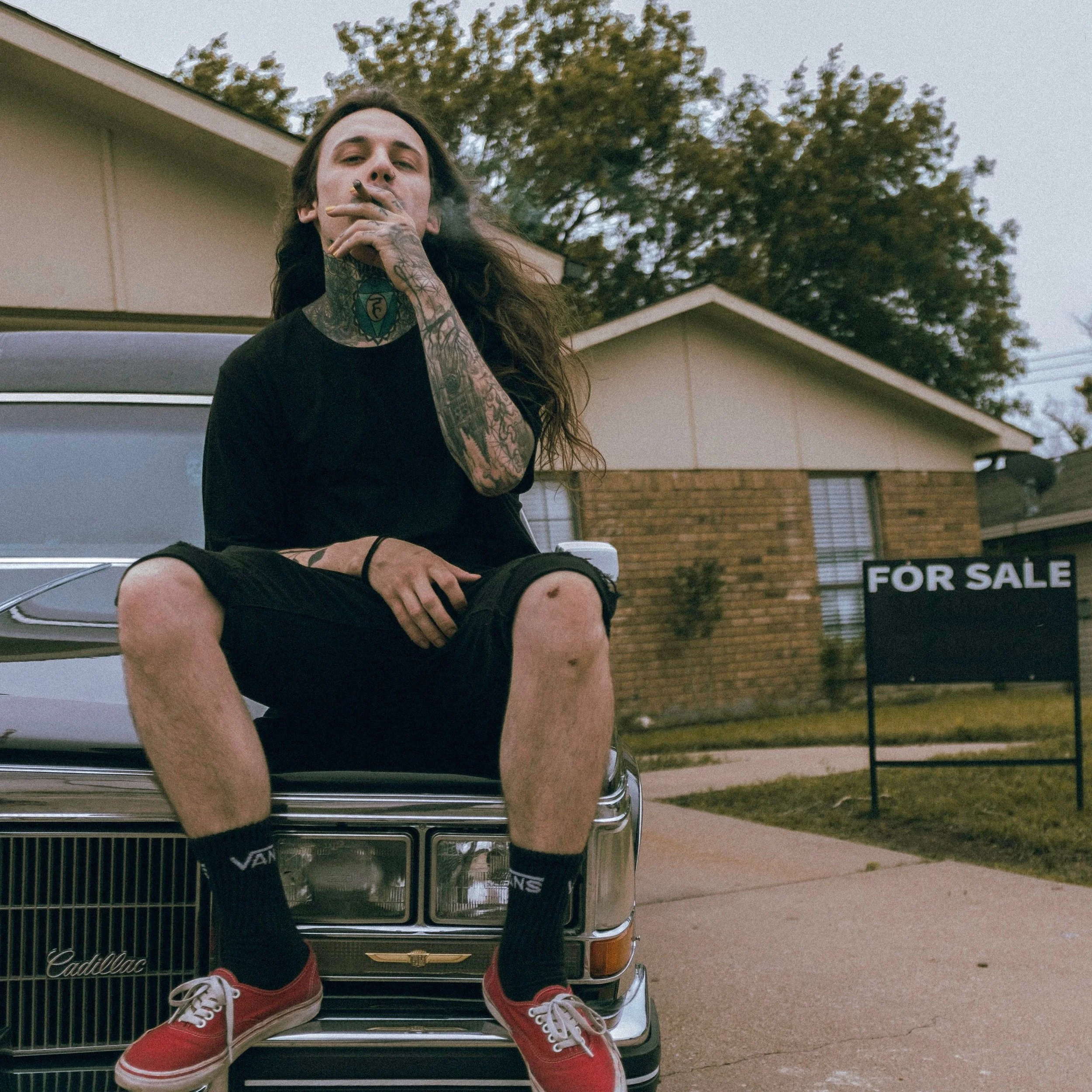 This man owns that hearse he’s sitting on in the picture