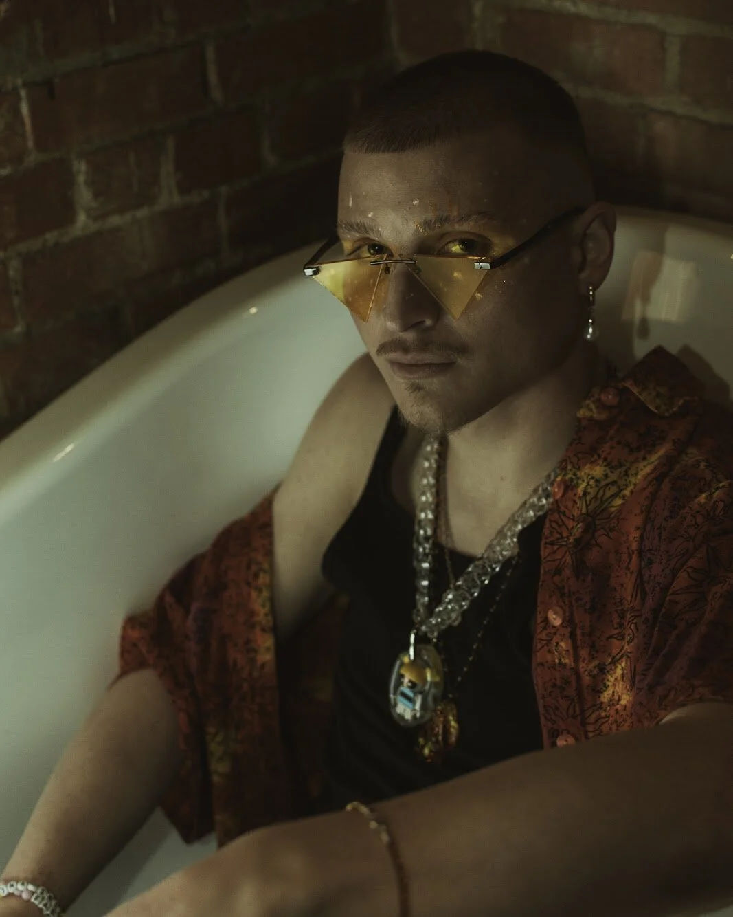 The Sunshine Pimp in a random bathtub, makeup by @devindavidartistry on Instagram