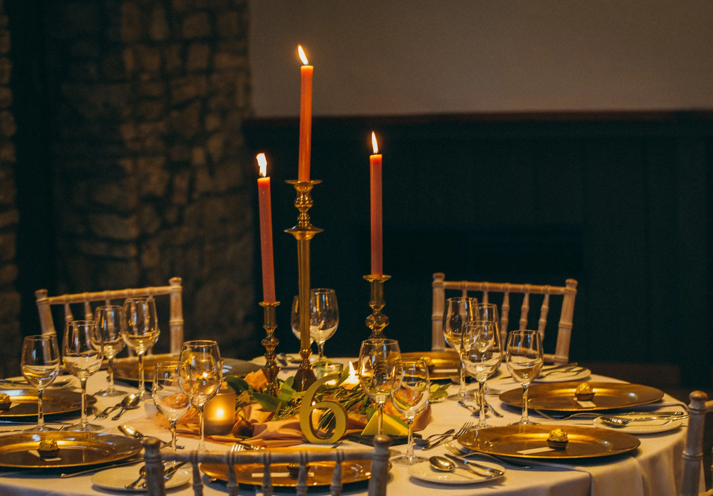 Alternative wedding table centre with brass candlesticks