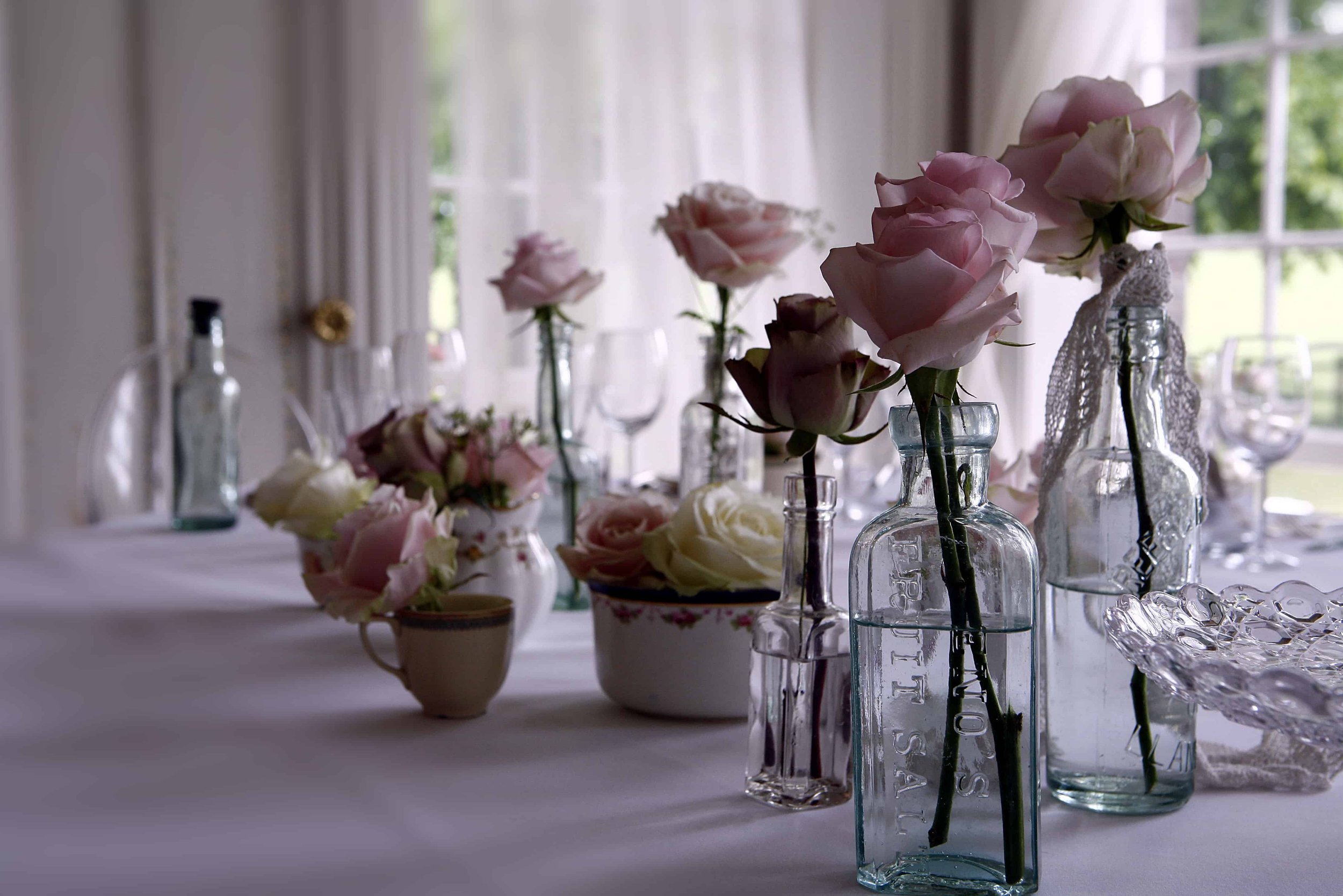 Florals in mix and match crockery and glassware.jpg