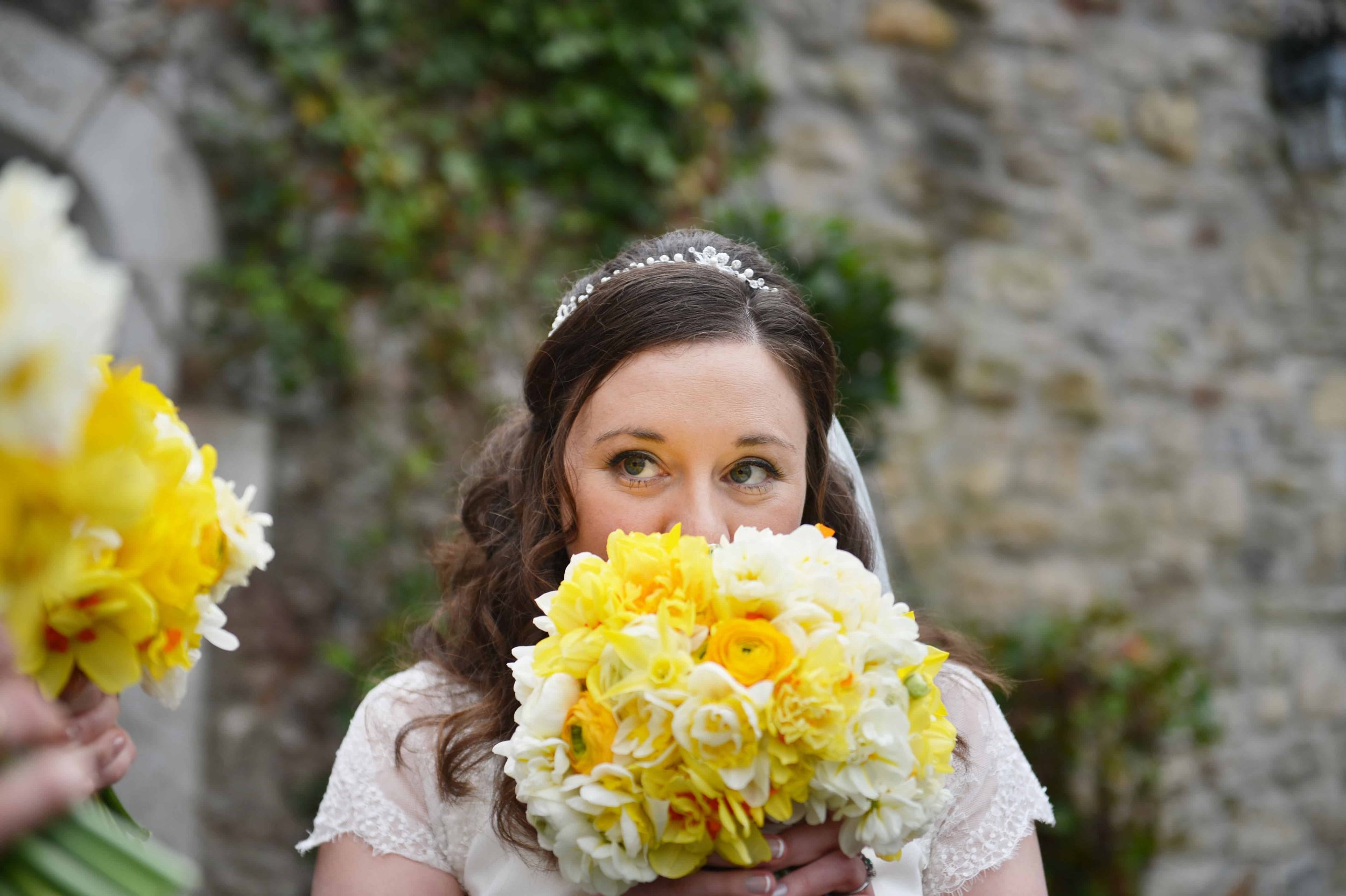 Bride smelling scented bouquet.JPG