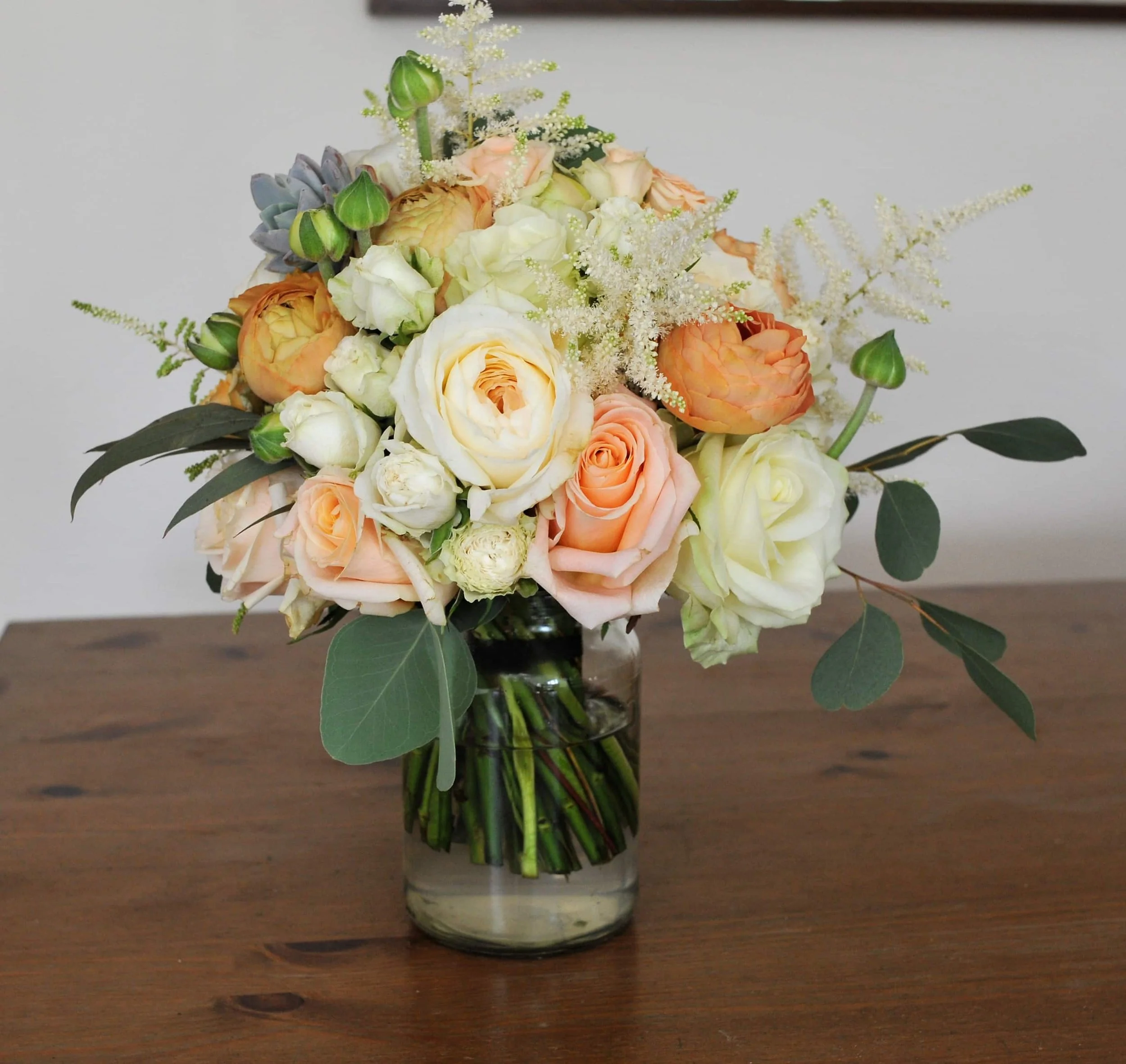 Bridal bouquet in peach and creams.JPG