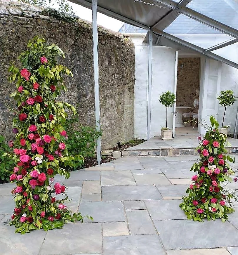 Floral pillars at Gileston Manor wedding.jpg