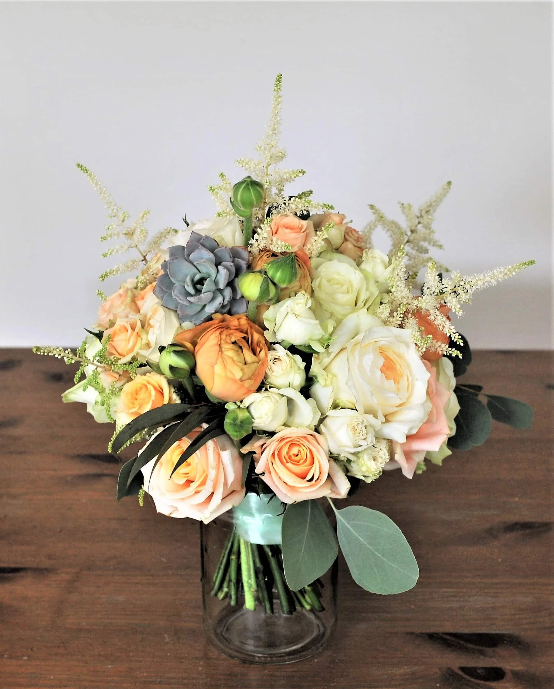 Bridal hand tie bouquet in peach and cream colours.JPG