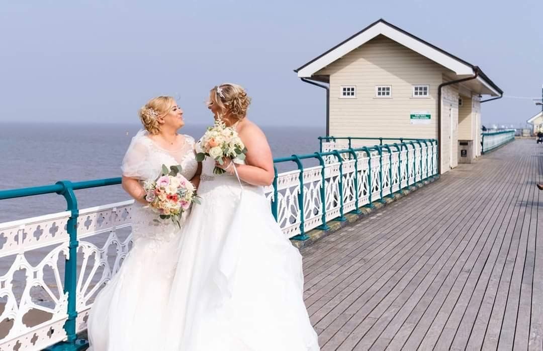 The beautiful brides with their bouquets.jpg