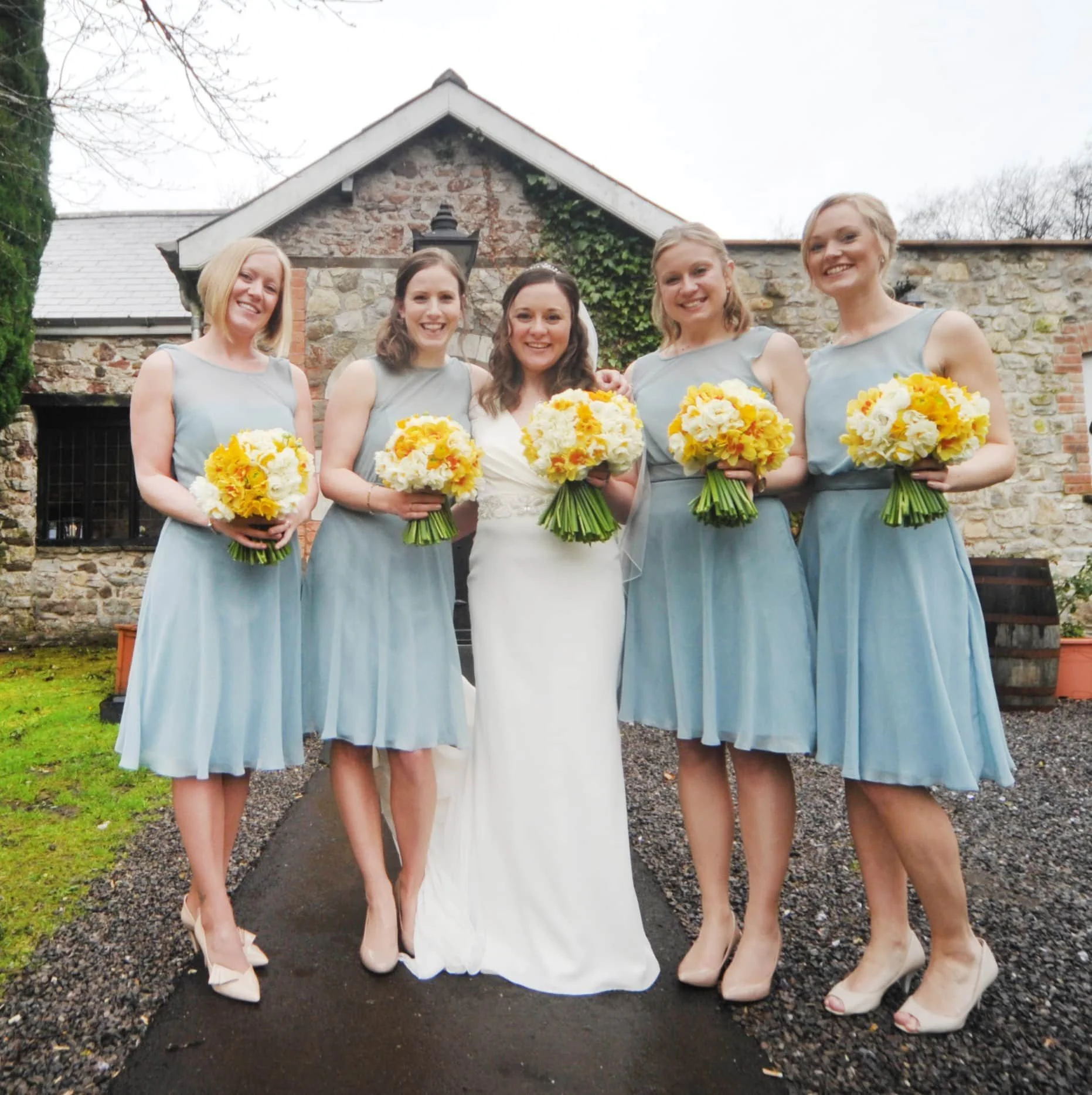 Bridal party with their flowers.JPG
