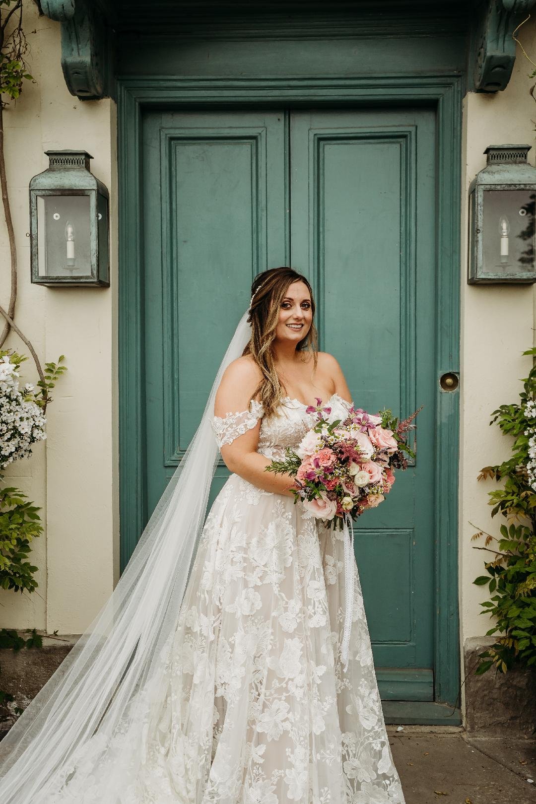 Cardiff wedding flowers summer bride holding bouquet at Gileston.jpg