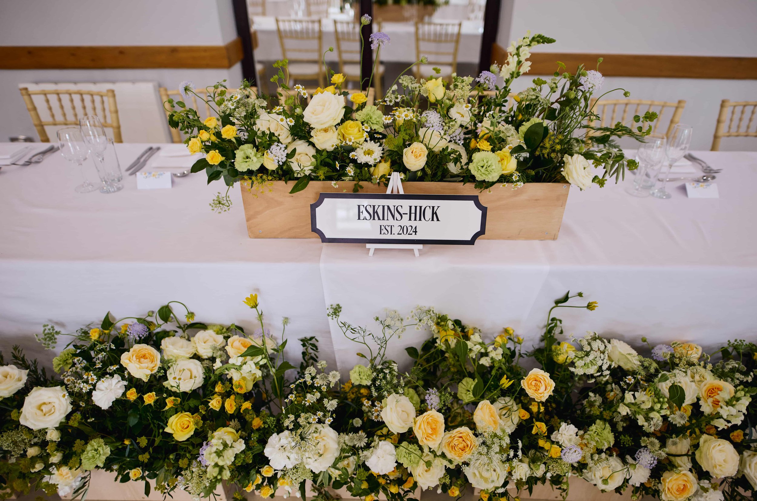 Wedding reception top table flowers for LGBTQ+ wedding.jpg