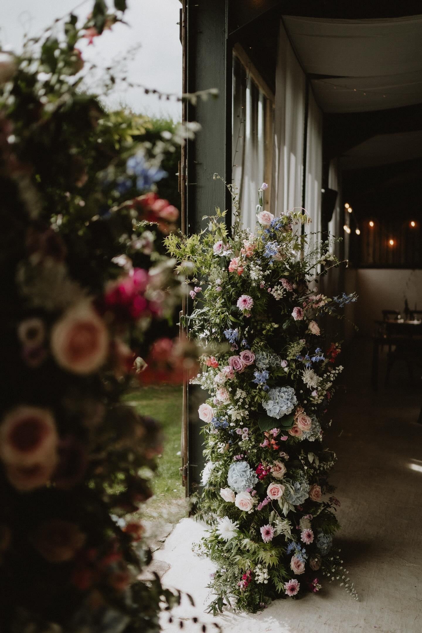 Ceremony floral pillars at Sugarloaf Barn.jpg