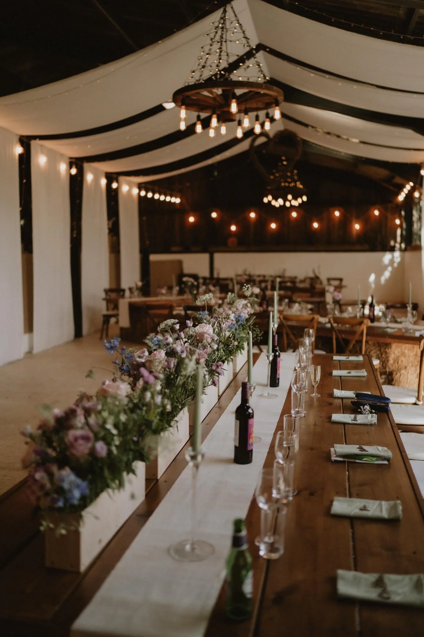 Top table summer wedding flowers at Sugarloaf Barn.jpg