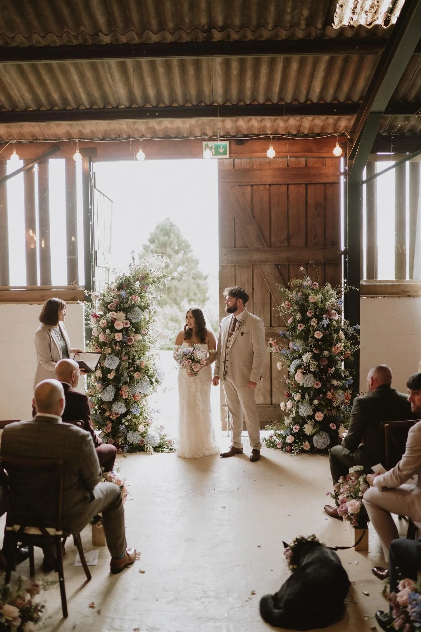 Summer wedding floral pillars at Sugarloaf Barn.jpg