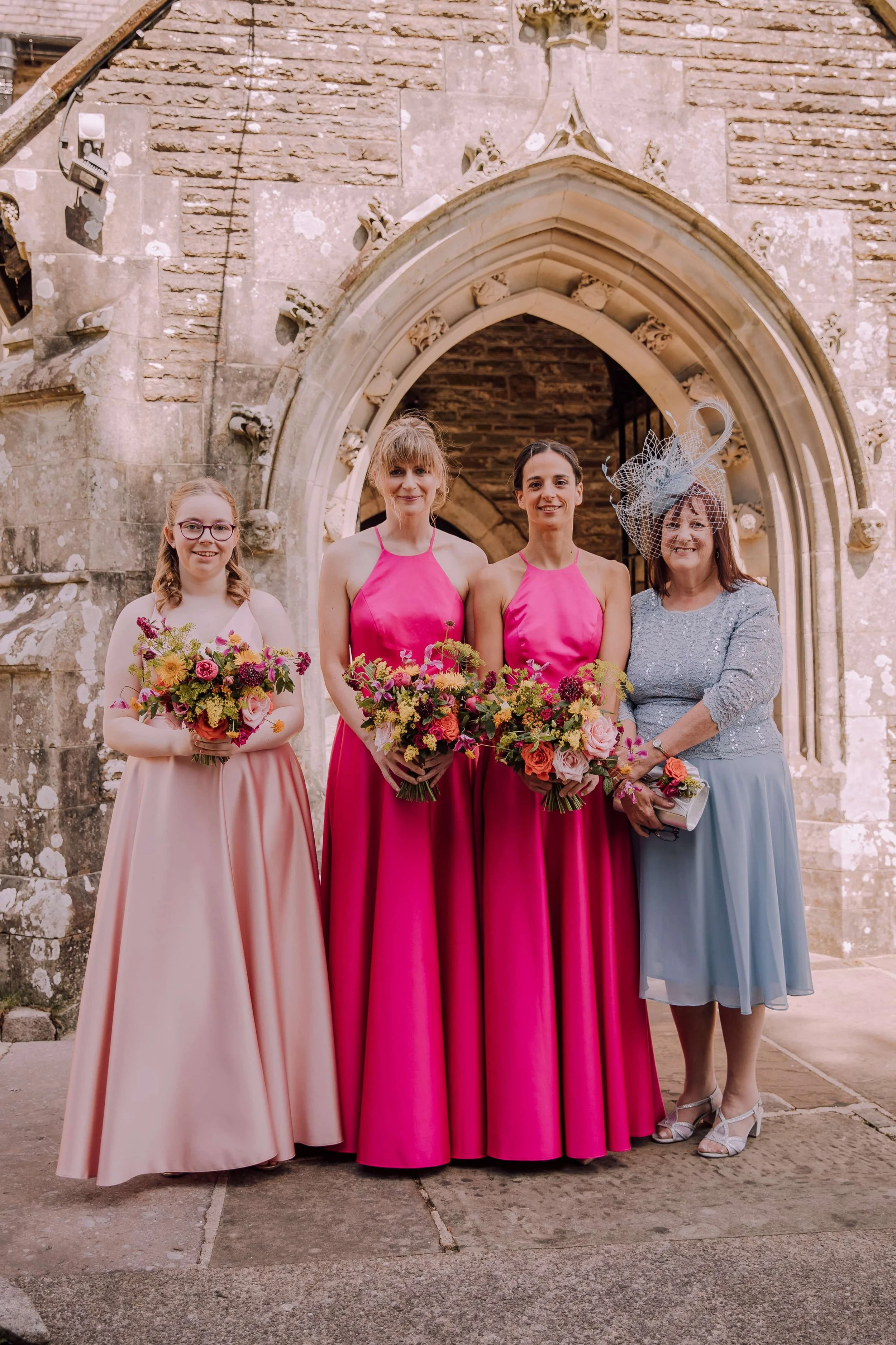 Bridesmaids with colourful summer bridal bouquets.jpg